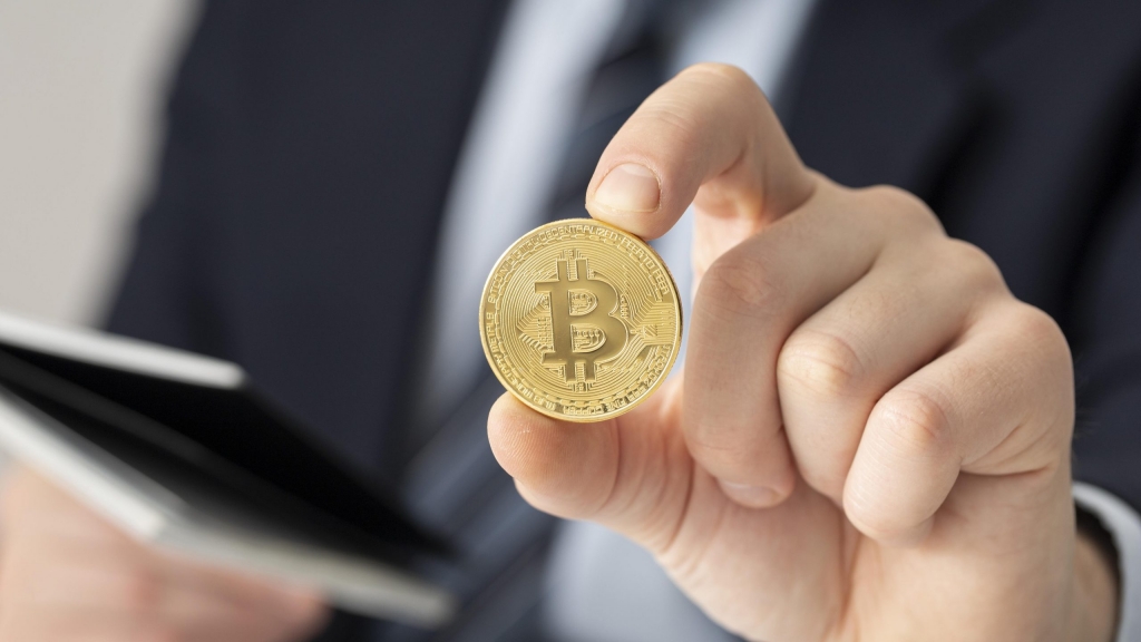 businessman-holding-bitcoin-close-up